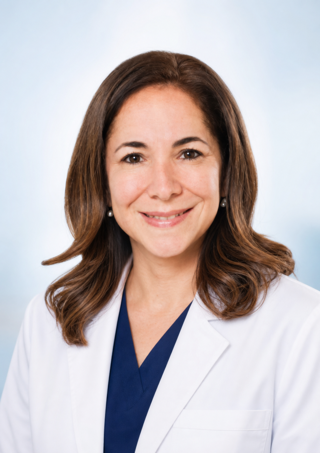 Dra. Sandra Betetta Riondato con bata médica